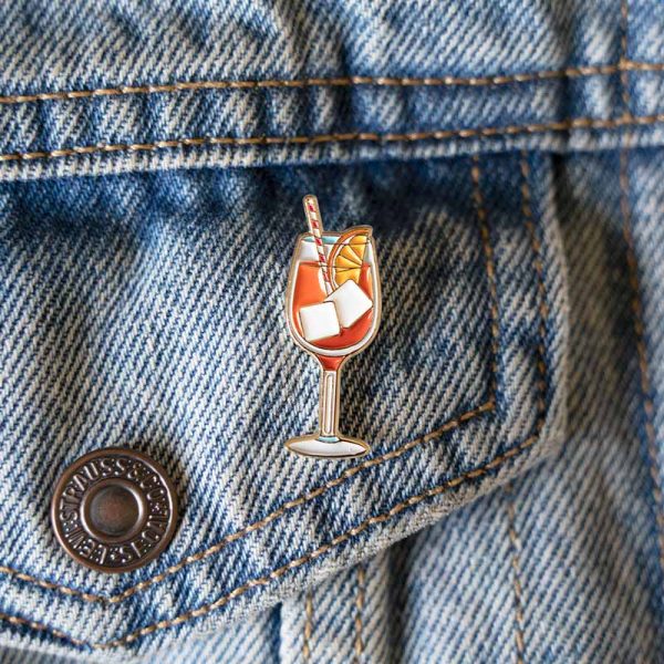 Aperol spritz pin badge on denim jacket