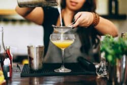 A bartender making a cocktail