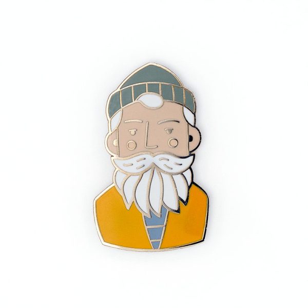 Fisherman wearing a beanie hat pin badge