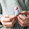 grey knitted christmas bobble hat brooch