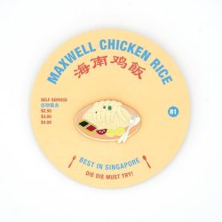 Chicken and rice brooch on a menu backing card