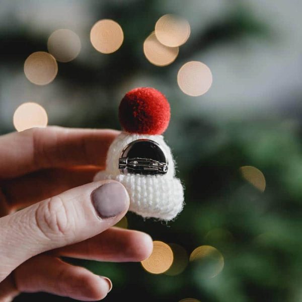 white knitted christmas bobble hat brooch back